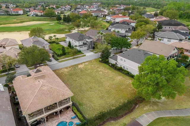 an aerial view of a swimming pool and lake view