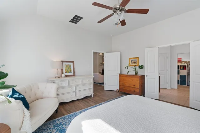 a bedroom with furniture and window