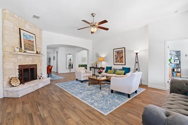 a living room with furniture and a fireplace
