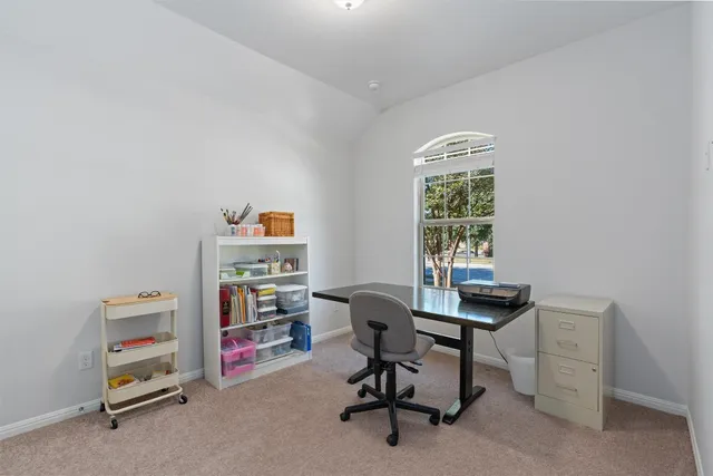 a view of a workspace with furniture