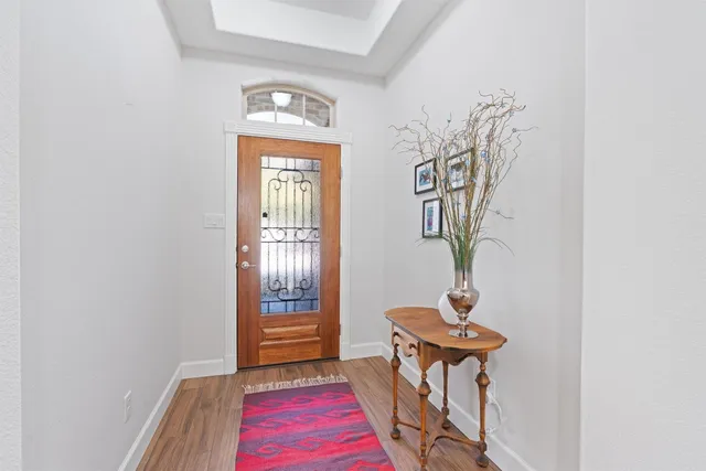 a view of a room with a small yard and wooden floor