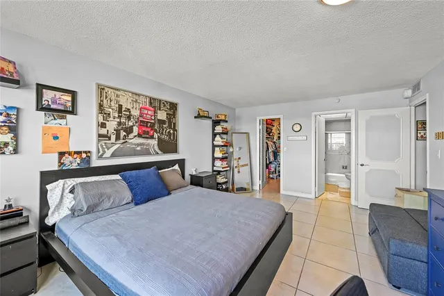 a bedroom with furniture and window