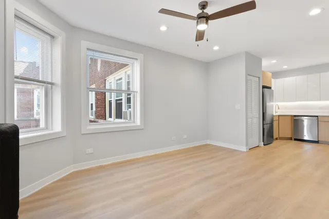 a view of livingroom with hardwood floor and ceiling fan