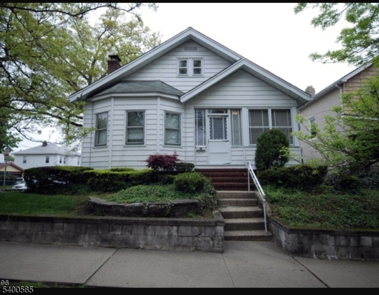 124 Overlook Avenue Belleville, NJ 07109 - Photo 1 of 4 a front view of a house with a yard