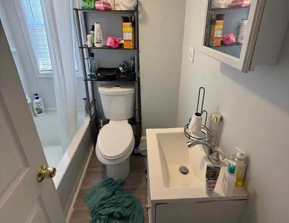 a storage room with wooden floor washer and dryer