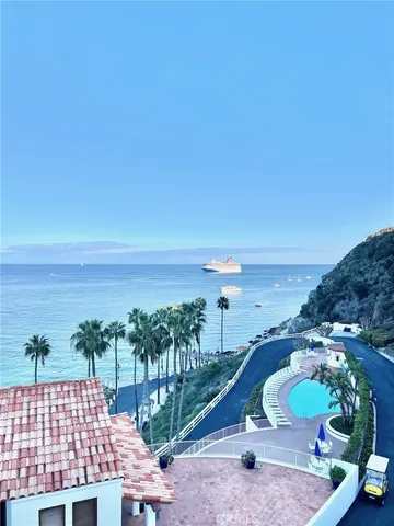 a view of room with workspace and windows