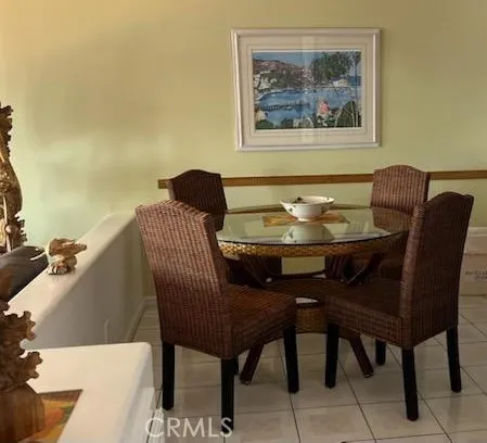 a kitchen with a stove a sink and white cabinets