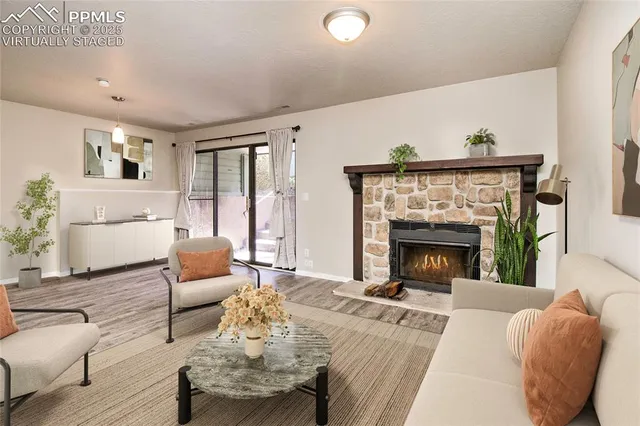 a living room with furniture and a fireplace
