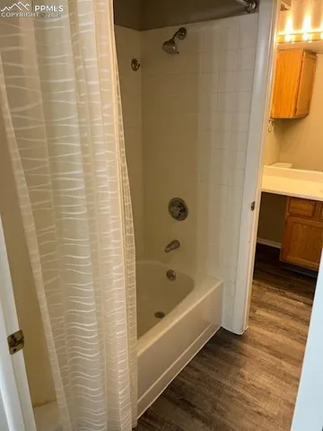 a bathroom with a toilet a sink and a mirror