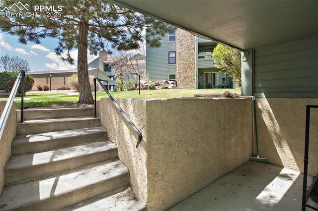 a living room with a couch and a table and chairs