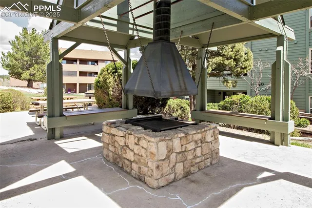 a view of a white house with a large space