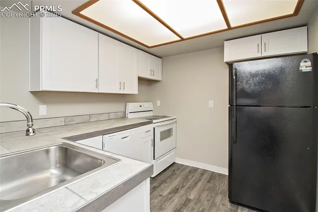 a kitchen with a sink and cabinets