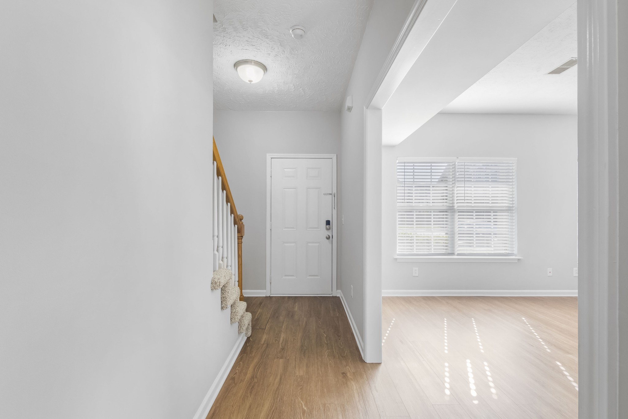 284 Meigs Drive, Unit F43 Murfreesboro, TN 37128 - Photo 5 of 25 an empty room with wooden floor and windows