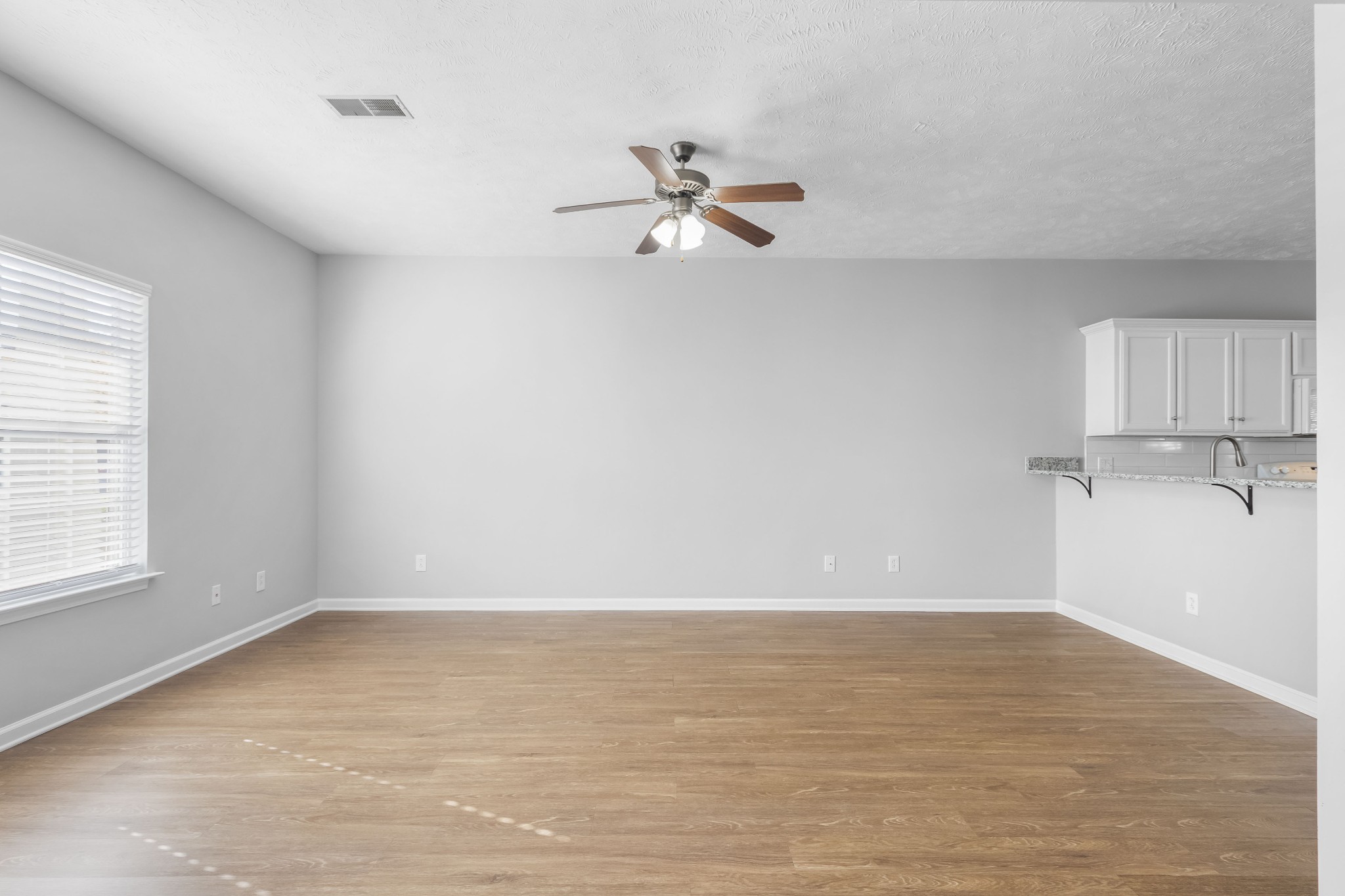 284 Meigs Drive, Unit F43 Murfreesboro, TN 37128 - Photo 6 of 25 wooden floor in an empty room with a window