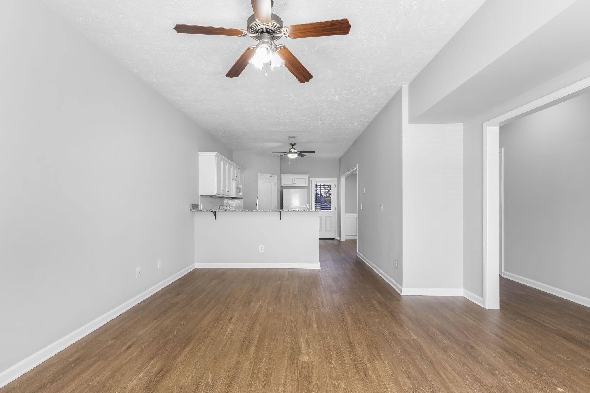 284 Meigs Drive, Unit F43 Murfreesboro, TN 37128 - Photo 8 of 25 wooden floor in an empty room with a window