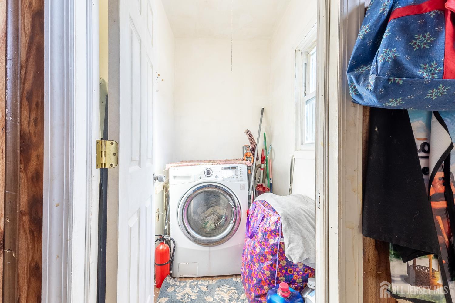 48 Locust Street Carteret, NJ 07008 - Photo 12 of 27 a utility room with dryer and washer