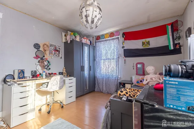 a bathroom with a granite countertop shower a toilet and a sink