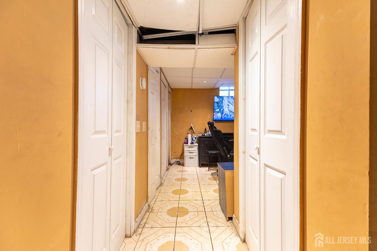 48 Locust Street Carteret, NJ 07008 - Photo 21 of 27 a walk in closet with a mirror