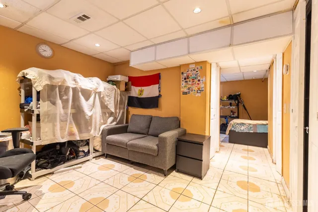 a bedroom with bed and a window