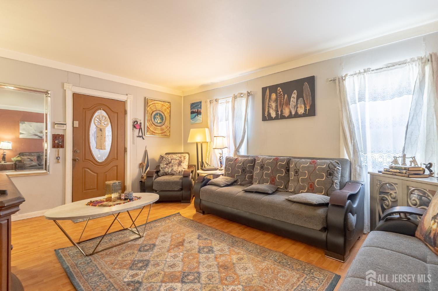 48 Locust Street Carteret, NJ 07008 - Photo 7 of 27 a living room with furniture and a window