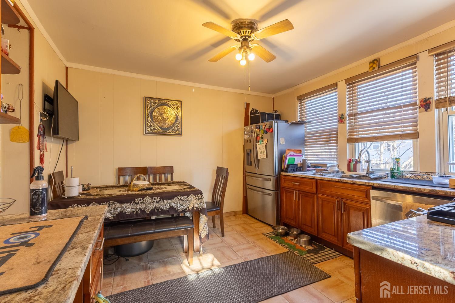48 Locust Street Carteret, NJ 07008 - Photo 8 of 27 a kitchen with a table and chairs