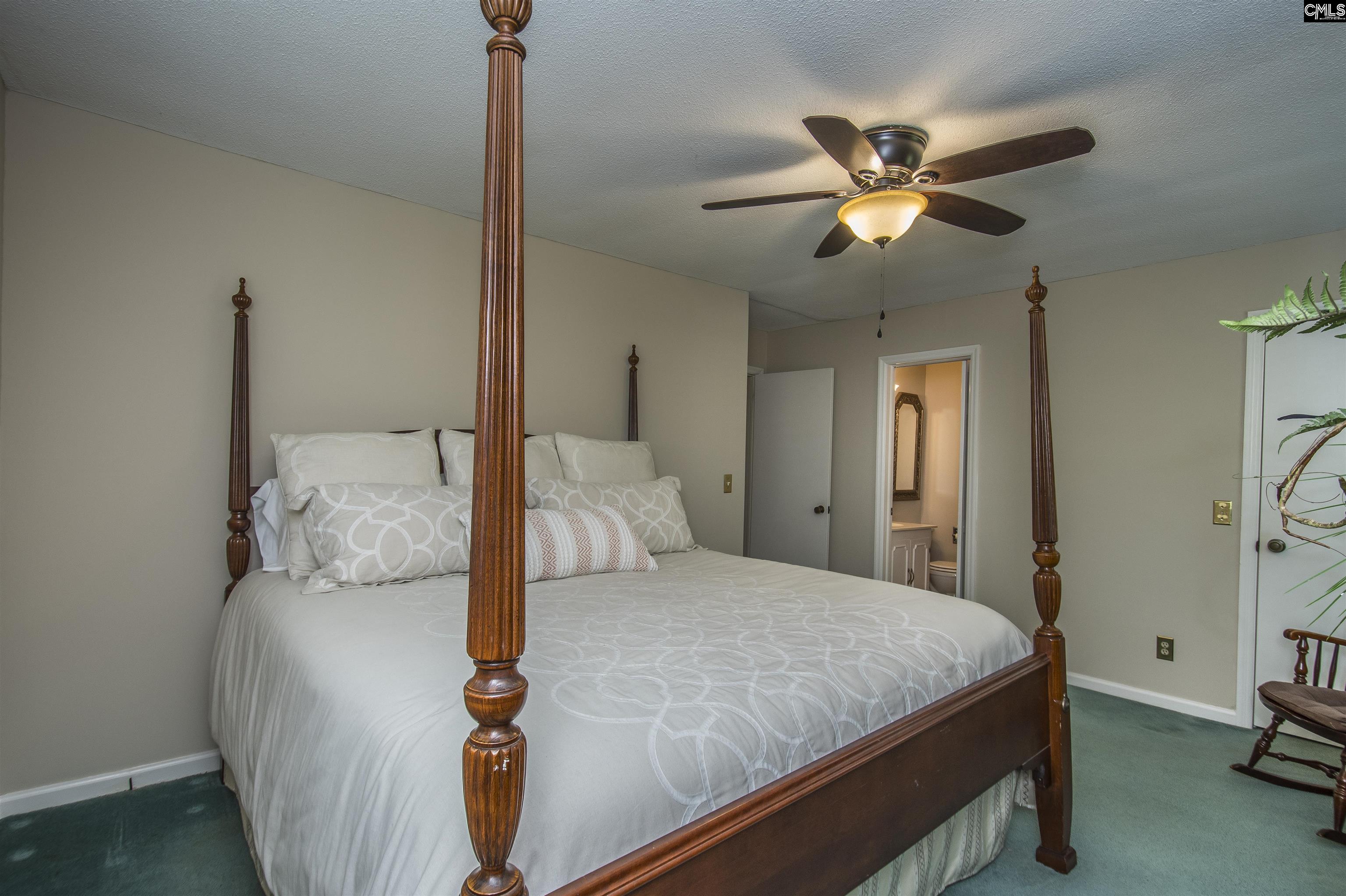 2309 Cunningham Road Columbia, SC 29210 - Photo 37 of 41 a bedroom with a bed and a chandelier