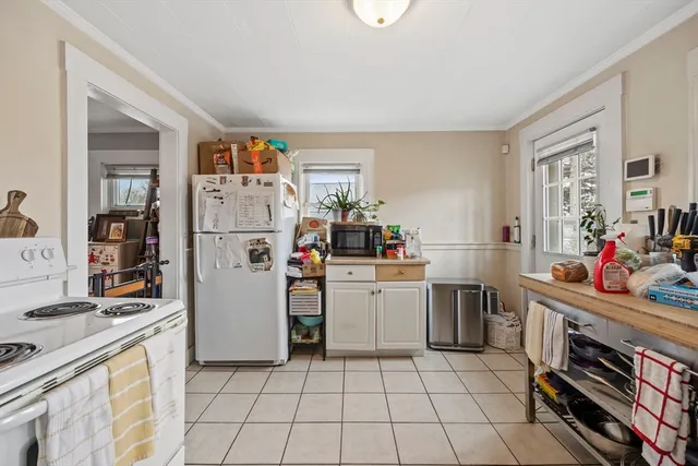 a bedroom with a bed and a view of bathroom