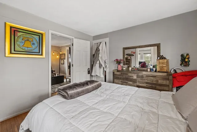 a bed room with a bed and a window