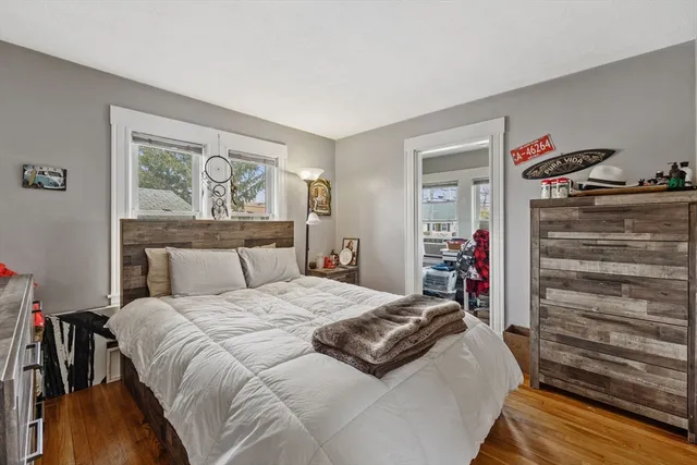 a living room filled with furniture and a window