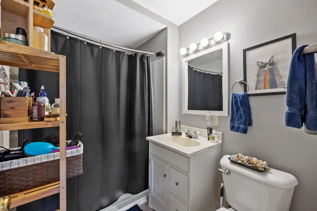 a bed room with furniture and a flat screen tv