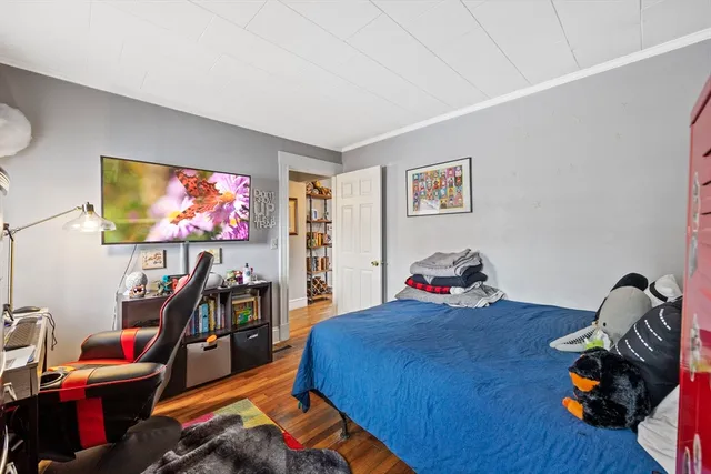 a room with furniture a rug and a window