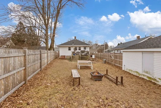 a view of a bench in a backyard