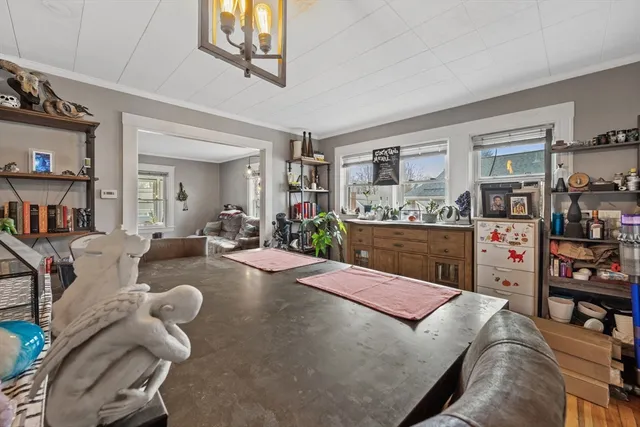 a living room with furniture and a book shelf