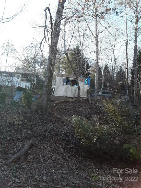 751 Bishop Lane, Unit 7 Mill Spring, NC 28756 - Photo 2 of 2 a view of a house with a yard
