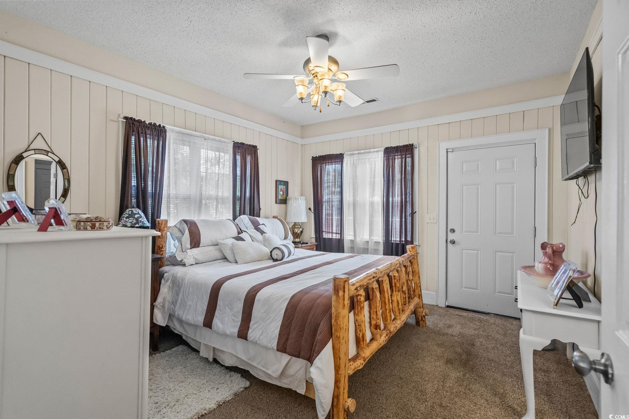 159 Brookgate Drive Myrtle Beach, SC 29579 - Photo 15 of 40 Bedroom with carpet floors, a textured ceiling, and ceiling fan