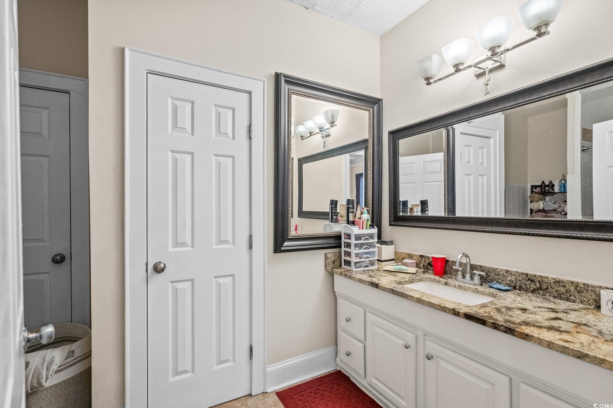 159 Brookgate Drive Myrtle Beach, SC 29579 - Photo 17 of 40 Bathroom featuring vanity and light tile patterned floors