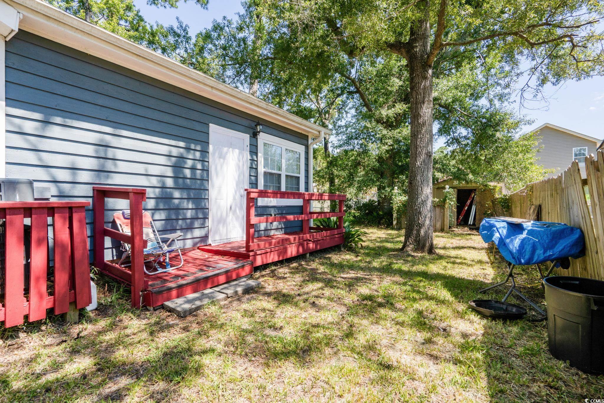 159 Brookgate Drive Myrtle Beach, SC 29579 - Photo 32 of 40 View of yard featuring a deck