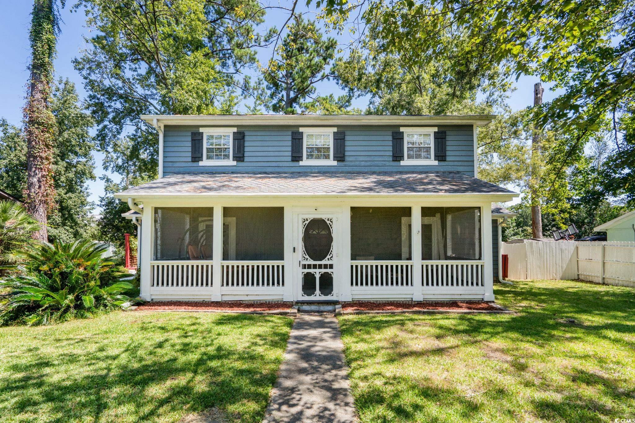 159 Brookgate Drive Myrtle Beach, SC 29579 - Photo 33 of 40 Traditional-style home featuring a front lawn and a sunroom