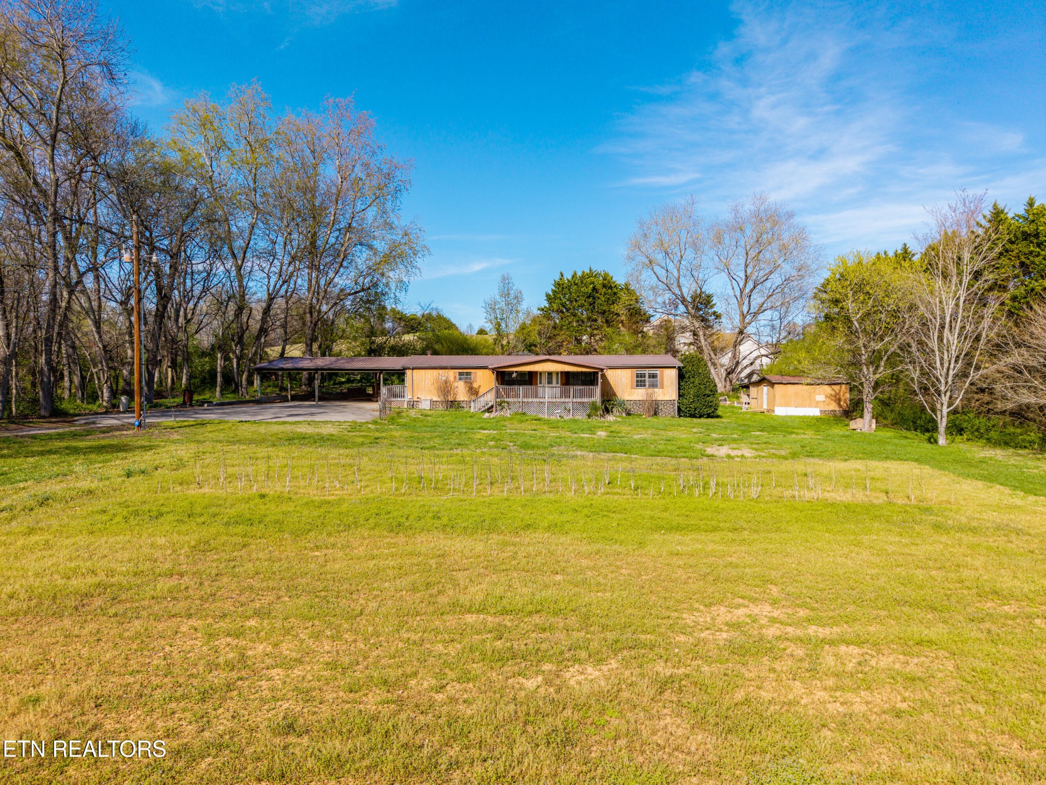 337 River Ford Road Maryville, TN 37804 - Photo 10 of 33 a view of a swimming pool with an outdoor space and seating area