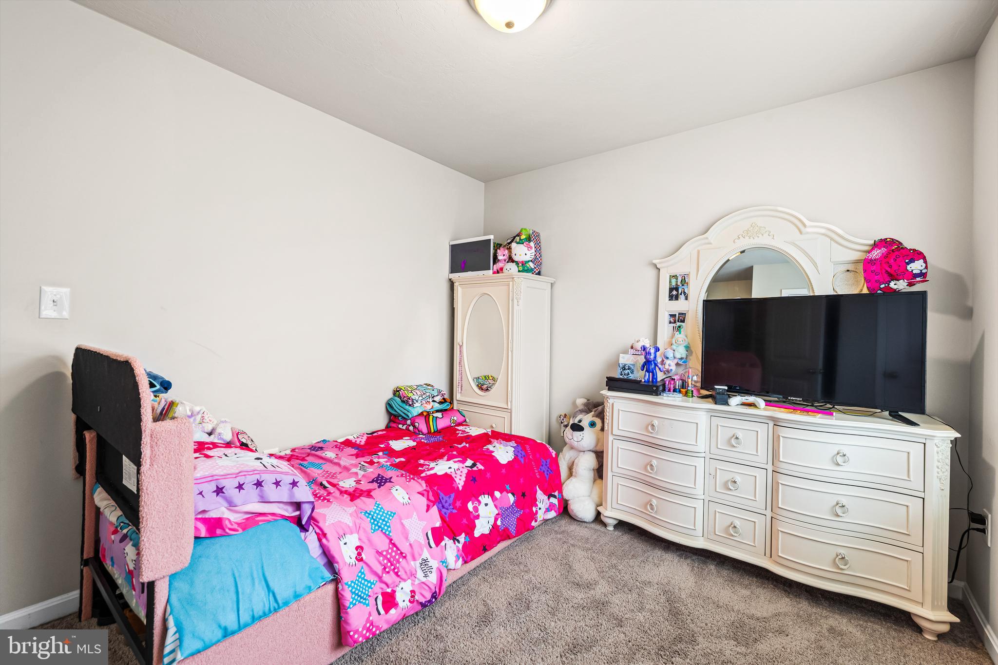 177 Skyview Circle Hanover, PA 17331 - Photo 15 of 18 a bedroom with a bed and a flat tv screen on dresser