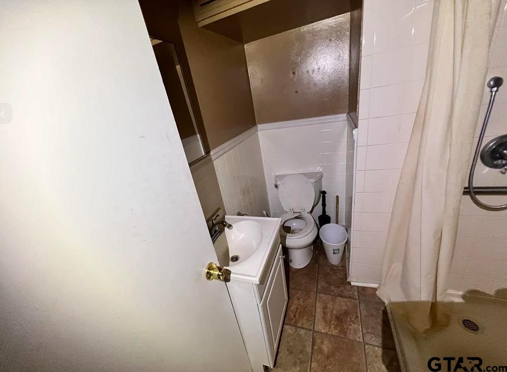 242 East Main Street Van, TX 75790 - Photo 15 of 20 a bathroom with a sink and toilet