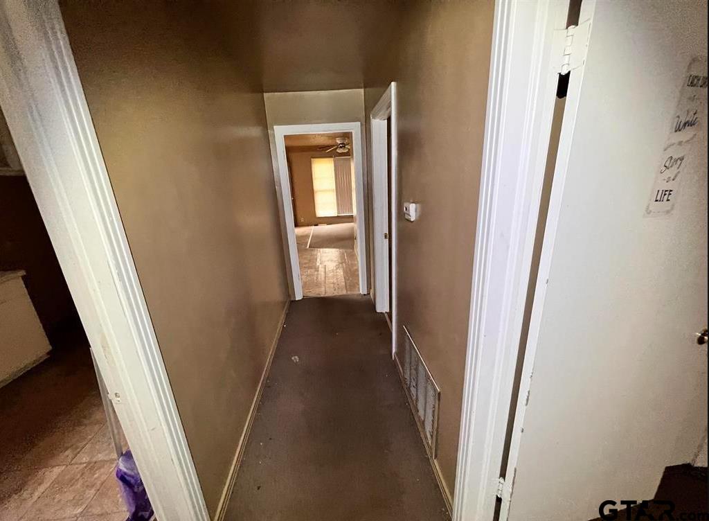 242 East Main Street Van, TX 75790 - Photo 16 of 20 a view of a hallway with a wooden door