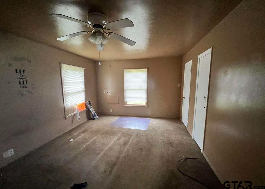 242 East Main Street Van, TX 75790 - Photo 18 of 20 a view of a room with a ceiling fan and window