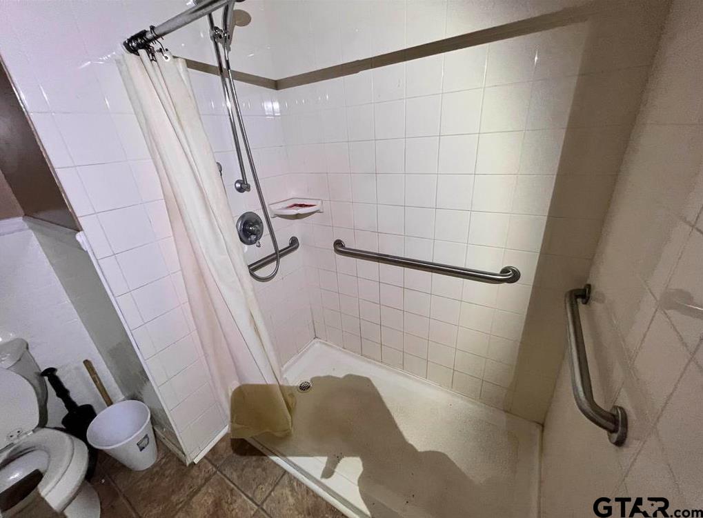 242 East Main Street Van, TX 75790 - Photo 19 of 20 a bathroom with a shower and toilet