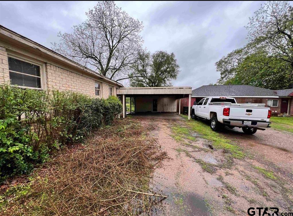 242 East Main Street Van, TX 75790 - Photo 3 of 20 a car parked in front of white house