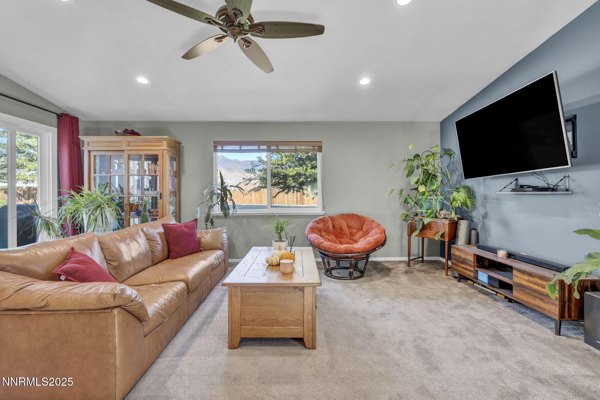 216 Gordon Lane Dayton, NV 89403 - Photo 3 of 16 a living room with furniture and a flat screen tv
