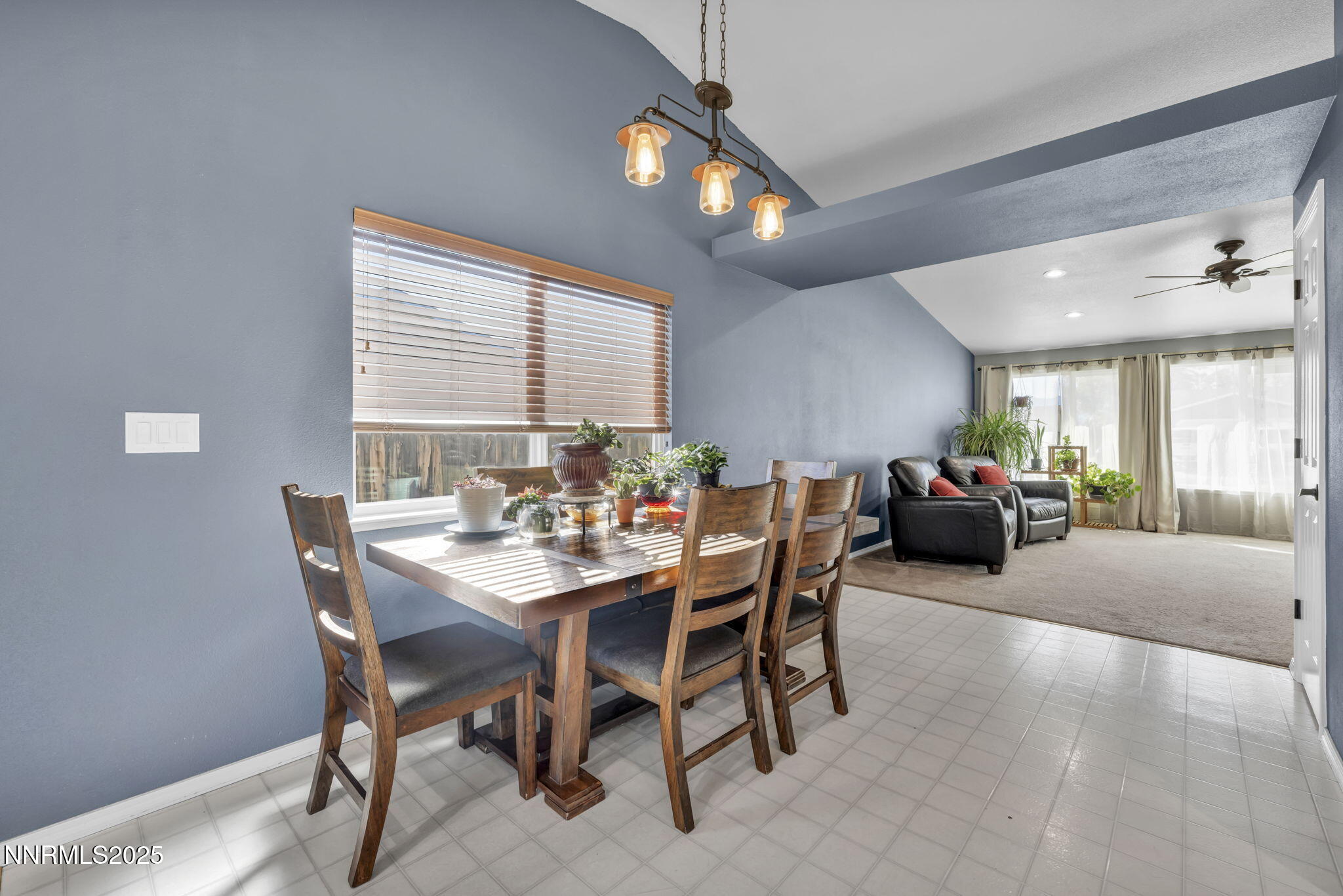 216 Gordon Lane Dayton, NV 89403 - Photo 5 of 16 a view of a dining room and livingroom with furniture wooden floor and a rug