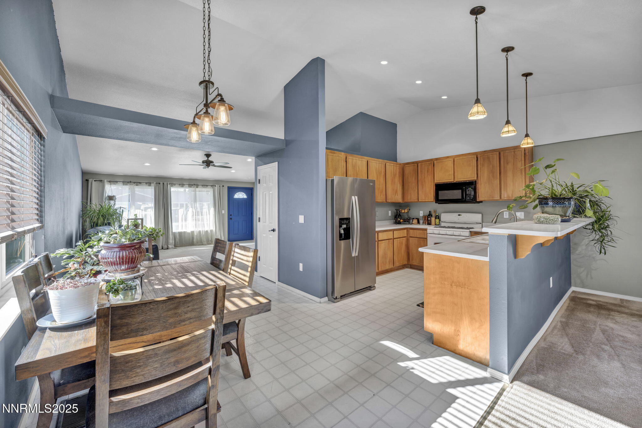 216 Gordon Lane Dayton, NV 89403 - Photo 6 of 16 a view of kitchen with stainless steel appliances kitchen island granite countertop a stove a sink a refrigerator and a center island