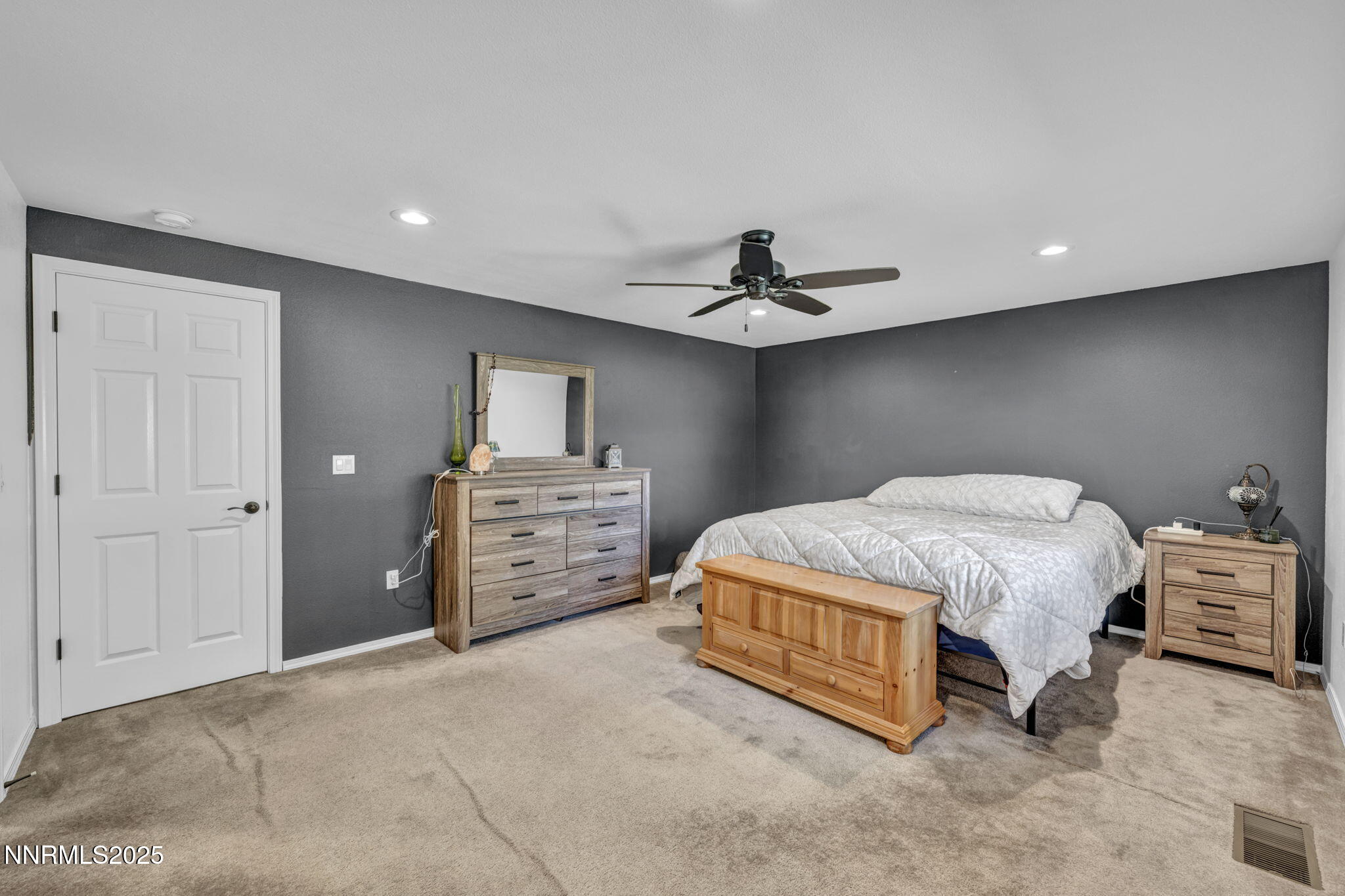 216 Gordon Lane Dayton, NV 89403 - Photo 8 of 16 a spacious bedroom with a bed and furniture