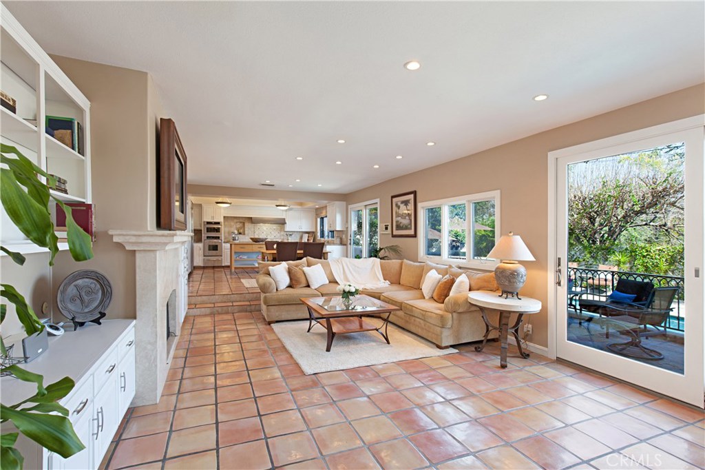 13032 St Thomas Drive North Tustin, CA 92705 - Photo 11 of 32 a living room with patio furniture and a flat screen tv
